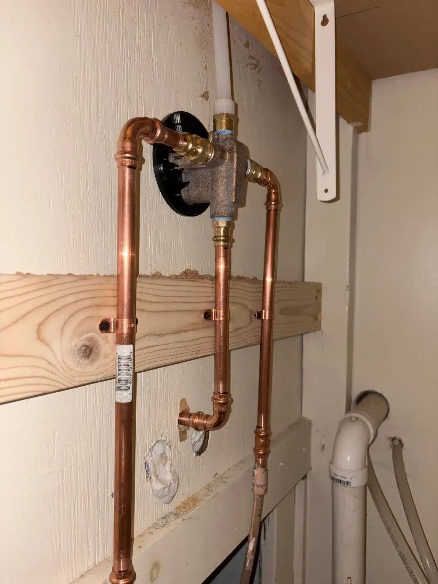 Newly Installed Shower Water Line In A Residential Bathroom In Groton, CT By TMG Plumbing And Disaster Solutions For Reliable Water Distribution.